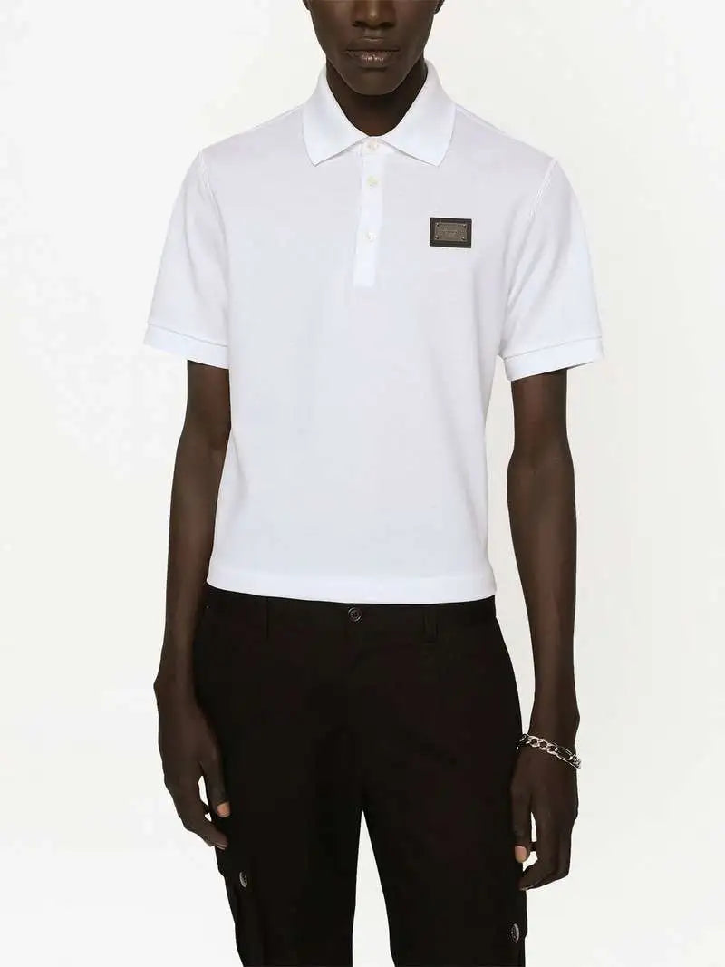 Polo Bianca con Placchetta Metallica Logo Dolce e Gabbana