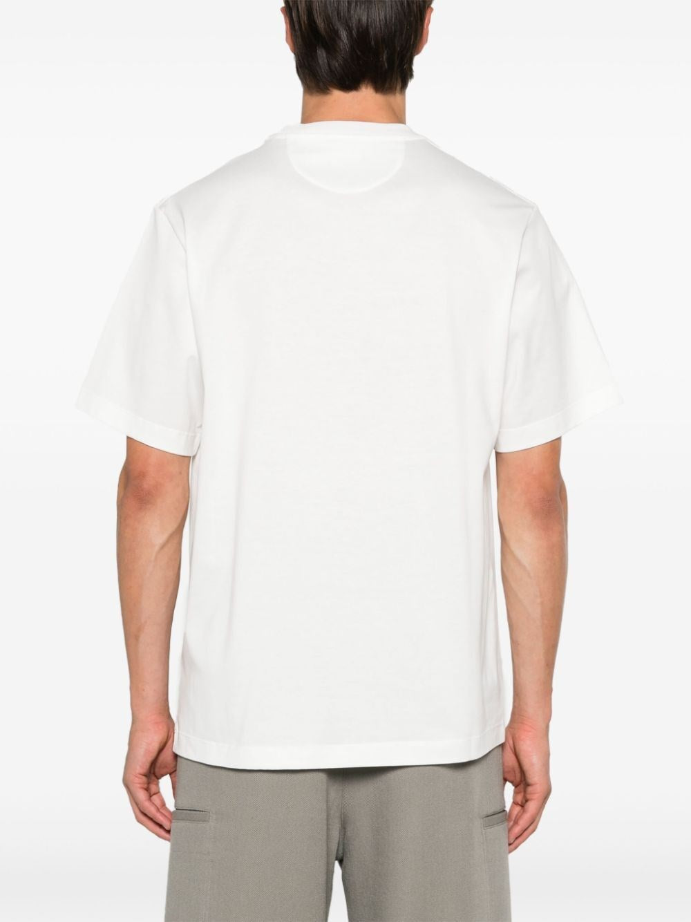 T-SHIRT BIANCA CON TASCHINO PELLE LOGO FENDI